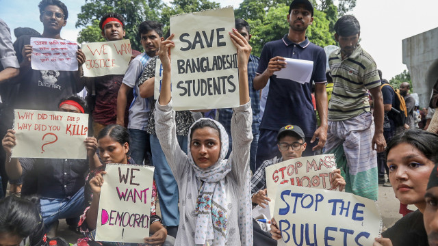Protesters hold up placards during a `March for Justice` in front of the Supreme Court area in Dhaka, Bangladesh, 31 July 2024